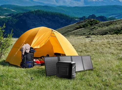 Type S foldable Solar panel shown set up with the powergen 500 next to a yellow tent